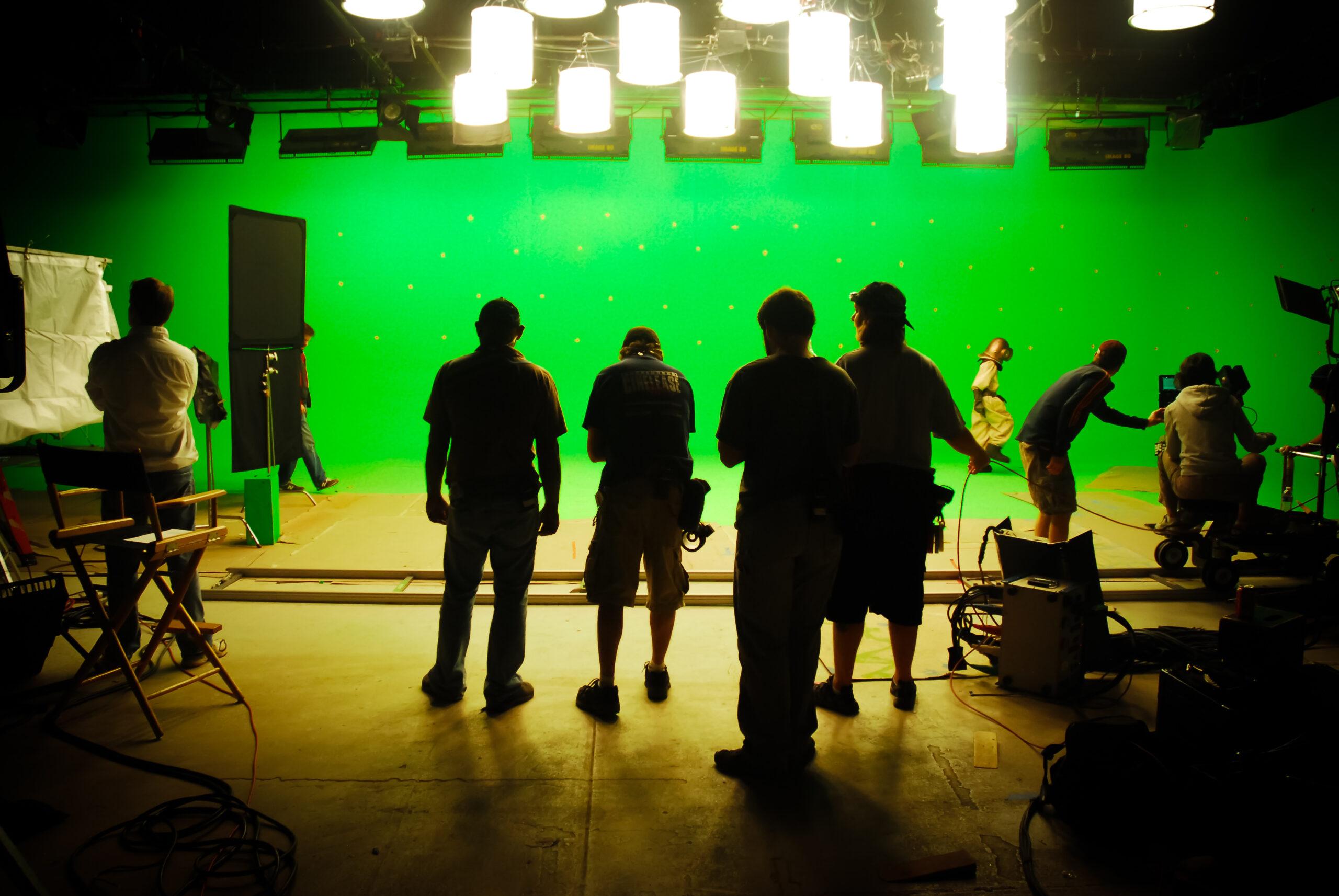 A group of filmmakers at work on a film set, showcasing the equipment and expertise of a professional film production company.